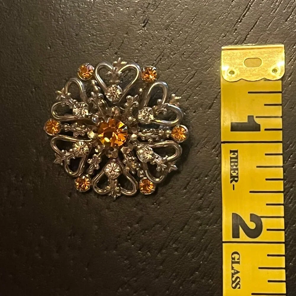 Vintage Gold Tone Starburst Brooch with Amber Topaz and Clear Rhinestones
